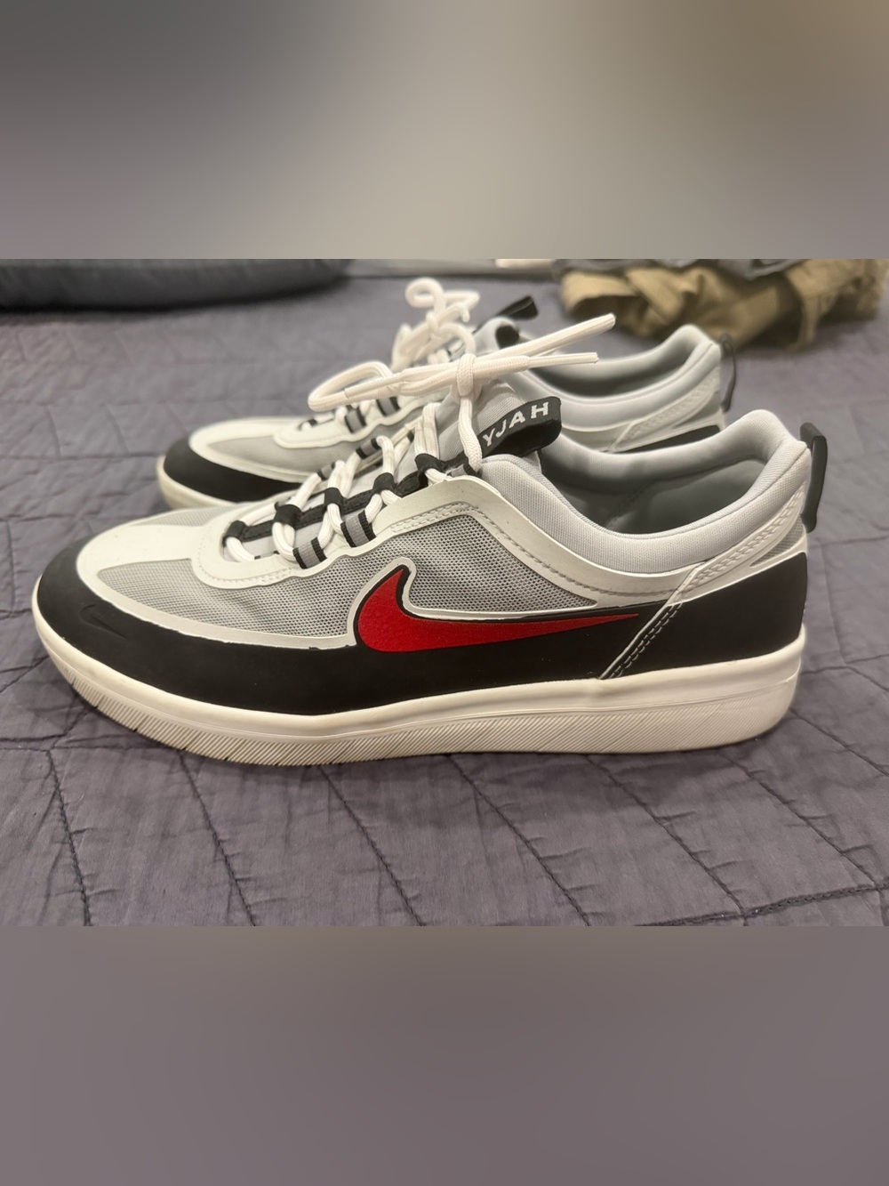 Nike White and Black Low-Top Sneakers with Red Swoosh
